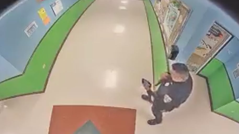 <div class="paragraphs"><p>Footage from the school shows officers retreating after they heard gunshots.</p></div>