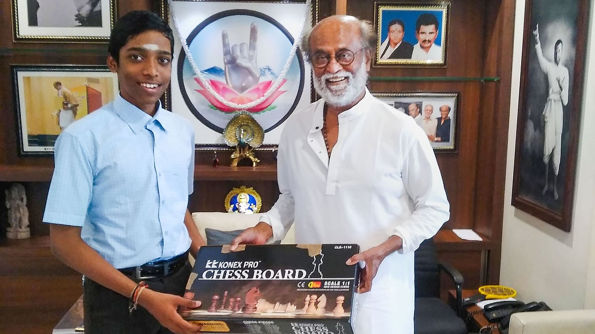 <div class="paragraphs"><p>Chennai: Veteran actor Rajinikanth receives a chessboard from Chess Grandmaster R. Praggnanandhaa.</p></div>