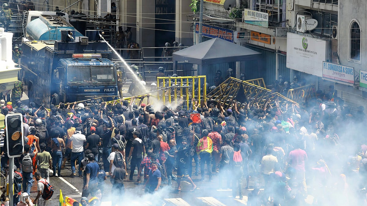 <div class="paragraphs"><p>Police use water canon and tear gas to disperse protesters in  Sri Lanka on Saturday, 9 July. </p></div>