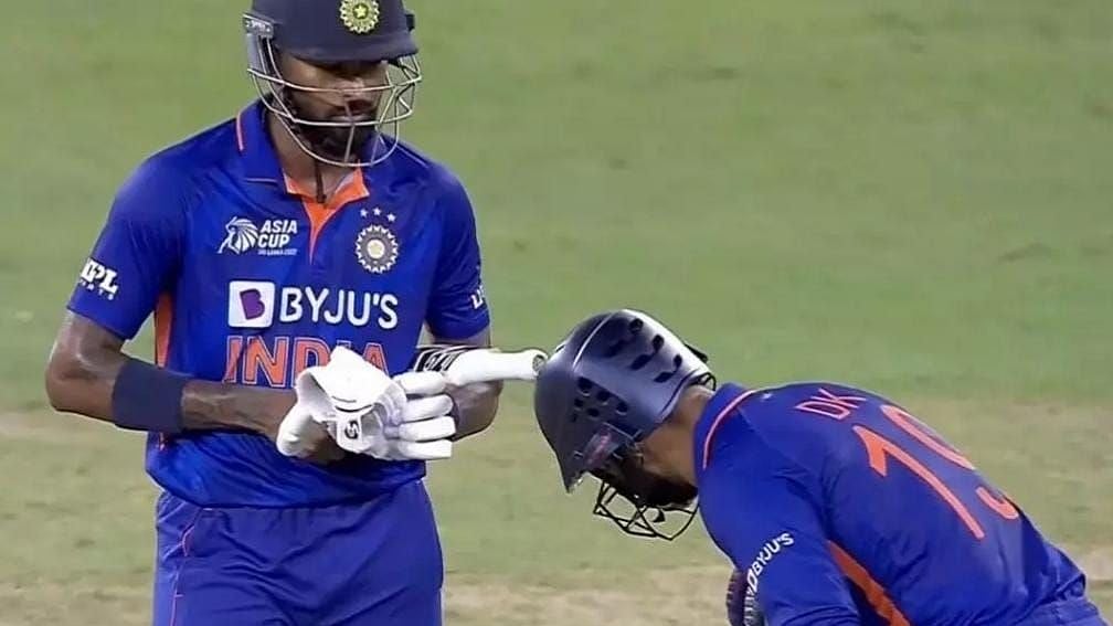 <div class="paragraphs"><p>Dinesh Karthik (right) bows down to Hardik Pandya following the latter's heroics that helped India beat Pakistan by five wickets in the Asia Cup Group A clash in Dubai.&nbsp;&nbsp;</p></div>