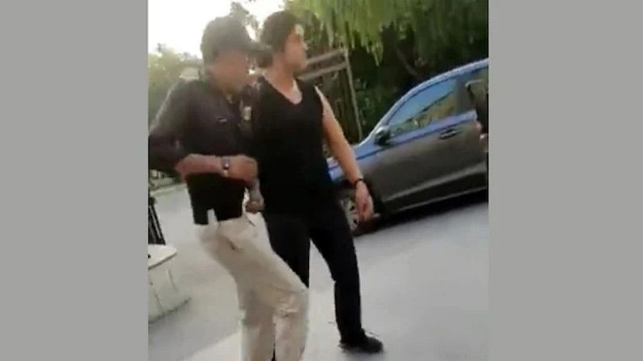 <div class="paragraphs"><p>Screenshot of the video in which the woman is purportedly seen abusing the security guards. </p></div>