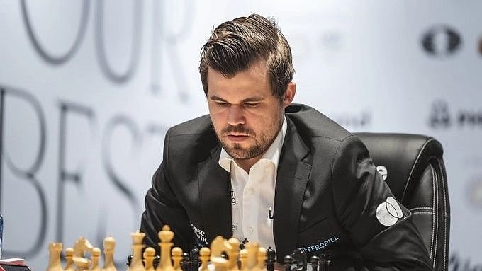 <div class="paragraphs"><p>Norwegian Magnus Carlsen grabbed the lead in the Julius Baer Generation Cup chess tournament after beating India's Arjun Erigaisi on Wednesday. </p></div>