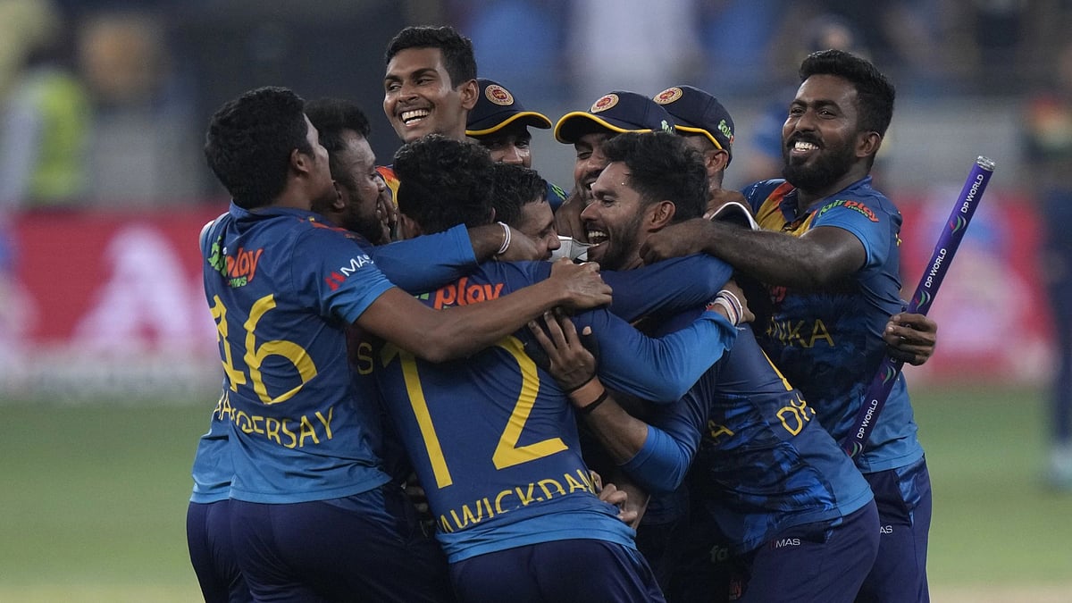 <div class="paragraphs"><p>Sri Lankan players celebrate after winning the Asia Cup final.</p></div>