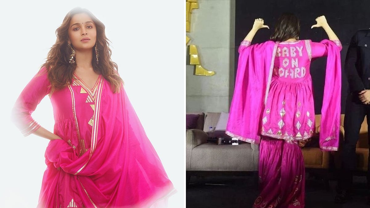 <div class="paragraphs"><p>Alia Bhatt flaunts 'Baby on Board' sign on the back of her outfit.</p></div>