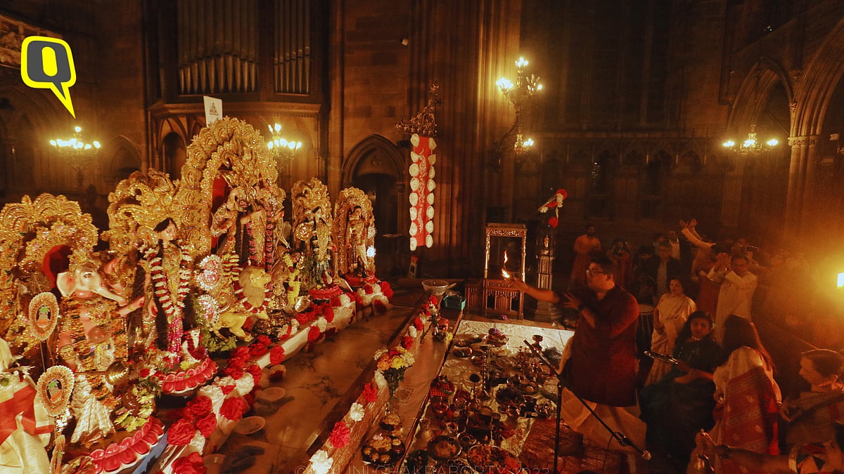 <div class="paragraphs"><p>A Priest performs the '<em>Shondhe Arati</em>' of the Goddess, as people take shelter from the stormy weather outside in the warm glow of an ancient church in Glasgow.</p></div>