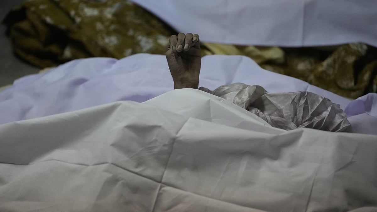 <div class="paragraphs"><p>A hand of a victim is seen after a cable bridge across the Machchu river collapsed in Morbi town of western state Gujarat.&nbsp;</p></div>