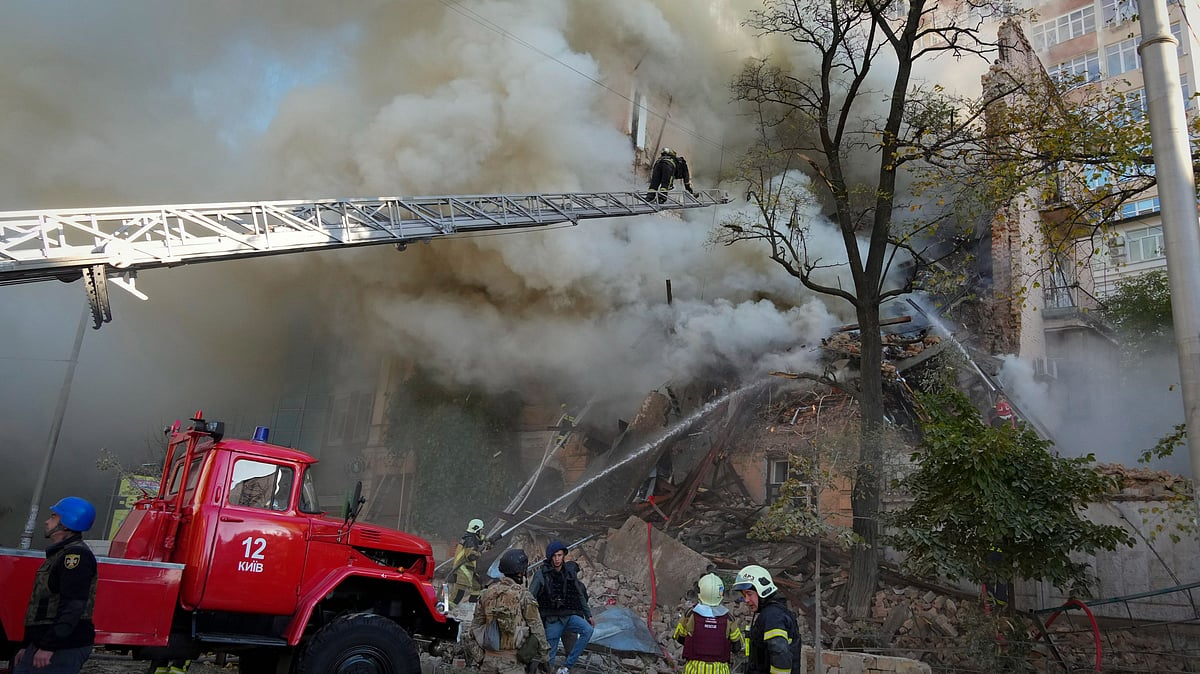 <div class="paragraphs"><p>Firefighters try to douse flames after a drone attack in Ukraine's Kyiv on Monday, 17 October. </p></div>