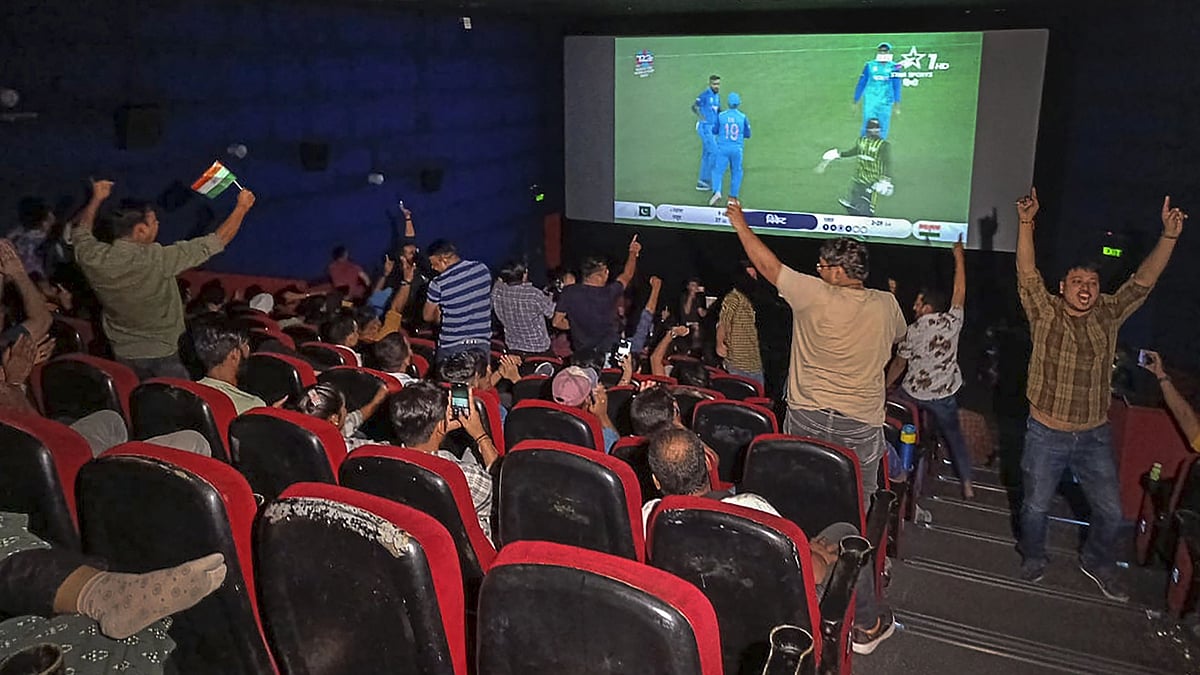 <div class="paragraphs"><p>People celebrate as they watch the live screening of the ICC men's T20 World Cup match between India and Pakistan, at Satyam INOX, Patel Nagar in New Delhi on Sunday. </p></div>