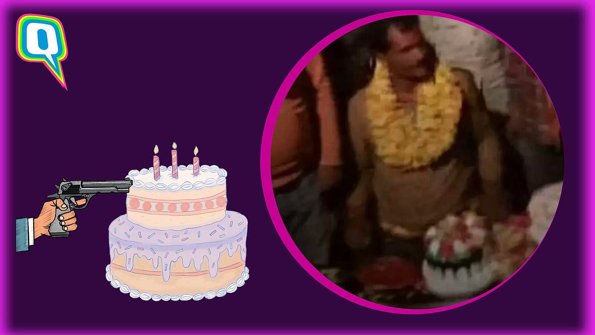 <div class="paragraphs"><p>Sarpanch cutting his cake with desi tamancha </p></div>