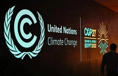 <div class="paragraphs"><p>A man walks past a board showing the 27th Conference of the Parties of the United Nations Framework Convention on Climate Change (COP27) in Sharm El-Sheikh, Egypt, Nov. 5, 2022. </p></div>