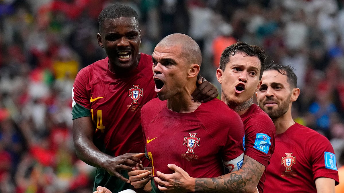 <div class="paragraphs"><p>Portugal's Pepe, middle, celebrates with teammates after scoring during the World Cup Round of 16 match against Switzerland.</p></div>
