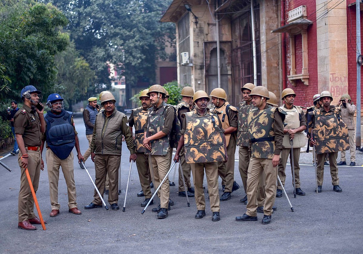 <div class="paragraphs"><p>Security personnel stand guard during a protest by Allahabad University students that erupted after a students leader allegedly stopped from entering the campus, in Prayagraj.</p></div>
