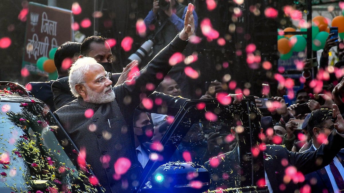 <div class="paragraphs"><p>Prime Minister Narendra Modi waves at supporters during a roadshow, in New Delhi</p></div>
