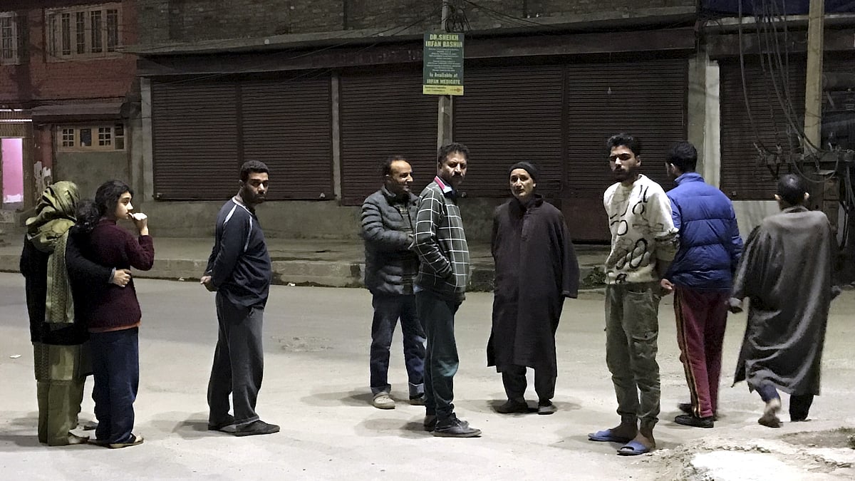 <div class="paragraphs"><p>People gather outside their homes after tremors were felt due to an earthquake in Srinagar on Tuesday, 21 March. </p></div>