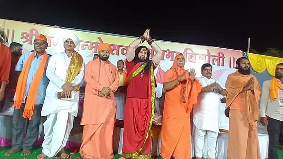 <div class="paragraphs"><p>Abhijeet Dhananjay Saraag alias Kalicharan (in red) at the 9 April event in Biloli. </p></div>