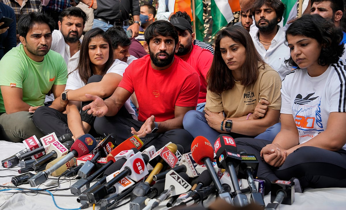 <div class="paragraphs"><p>Wrestlers Bajrang Punia, Vinesh Phogat, Sakshi Malik and others addressing the press during their protest in Delhi's Jantar Mantar. </p></div>