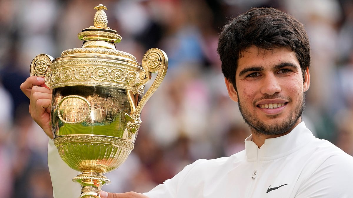 <div class="paragraphs"><p>Spain's Carlos Alcaraz celebrates with the trophy after beating Serbia's Novak Djokovic to win the final of the mens singles on day fourteen of the Wimbledon tennis championships in London</p></div>