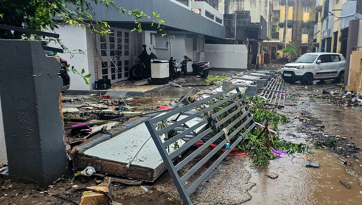 <div class="paragraphs"><p>A collapsed compound wall amid heavy monsoon rains in Junagadh on Saturday, 22 July.&nbsp;</p></div>