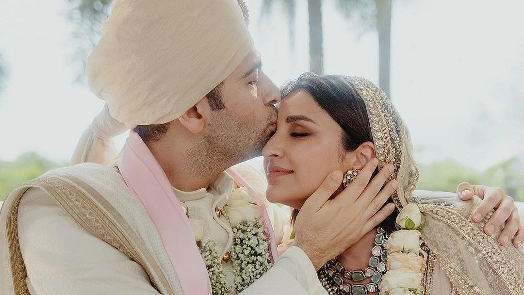 <div class="paragraphs"><p>Parineeti Chopra and Raghav Chadha share the first photos from their wedding.</p></div>