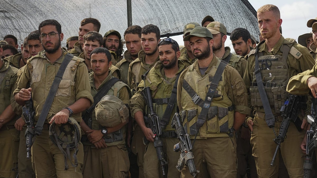 <div class="paragraphs"><p>Israeli soldiers listen to Israel's Defense Minister Yoav Gallant during his visit to a staging area near the border with the Gaza Strip in southern Israel</p></div>