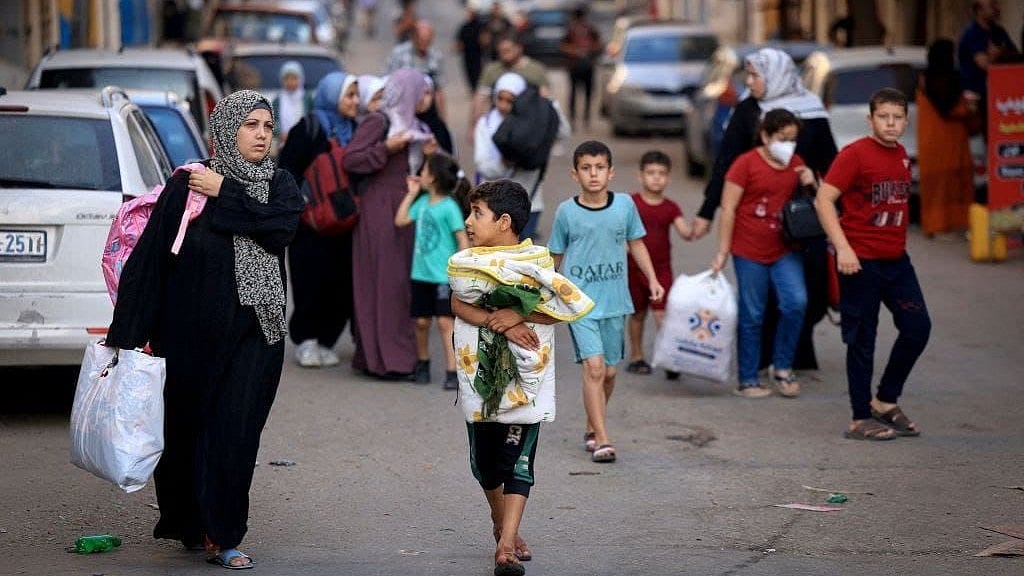 <div class="paragraphs"><p>Palestinians fleeing North Gaza after an evacuation warning from the Israel Defense Forces.</p></div>
