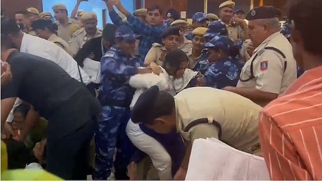 <div class="paragraphs"><p>Several TMC leaders took to X to upload visuals of the detention. While one video shows party leaders being taken away in a police van, others show Delhi Police personnel forcefully removing TMC leaders Mahua Moitra and Abhishek Banerjee from the protest site.</p></div>