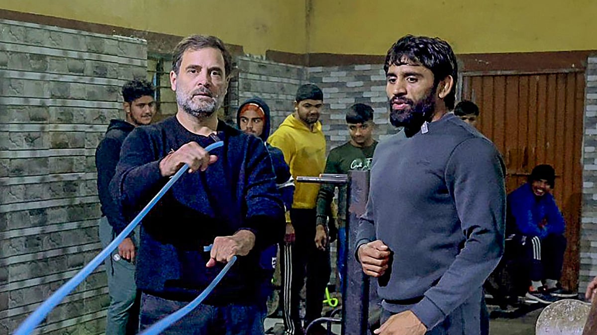 <div class="paragraphs"><p>Jhajjar: Congress leader Rahul Gandhi with wrestler Bajrang Punia and other wrestlers at Chhara village, in Jhajjar district, Wednesday, Dec. 27, 2023.</p></div>