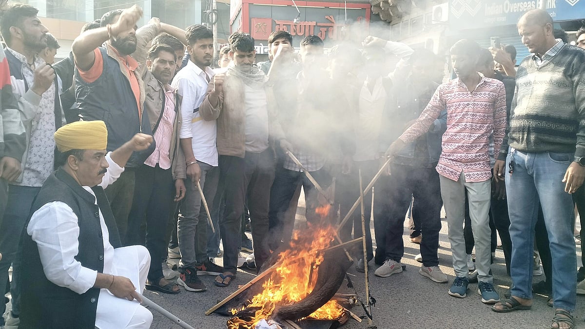 <div class="paragraphs"><p>The supporters of Rajput leader Sukhdev Singh Gogamedi burn tyres on Wednesday, 6 December, a day after he was shot dead at his Jaipur residence.&nbsp;</p></div>