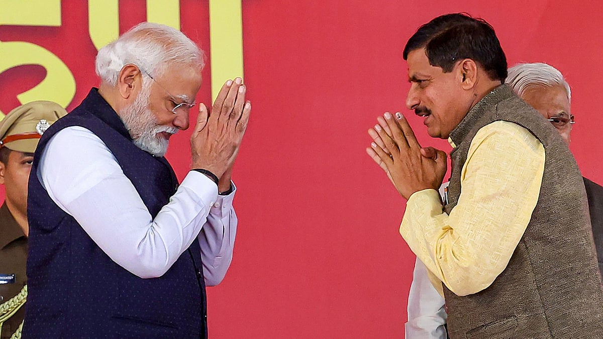 <div class="paragraphs"><p>PM Modi and Mohan Yadav greet each other at the latter's oath-taking ceremony in Bhopal as the chief minister of Madhya Pradesh on Wednesday, 13 December. </p></div>