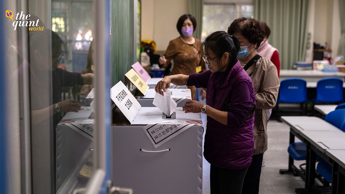 <div class="paragraphs"><p>People cast a vote at a polling station during the elections in New Taipei City Saturday, 13 January, 2024.</p></div>