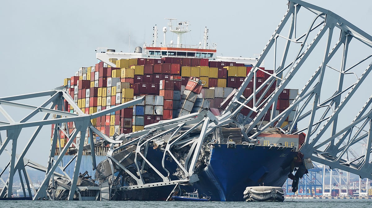 <div class="paragraphs"><p>A Coast Guard cutter passes a cargo ship that is stuck under the part of the structure of the Francis Scott Key Bridge after the ship his the bridge on Tuesday, 26&nbsp;March  2024, in Baltimore, Md. </p></div>