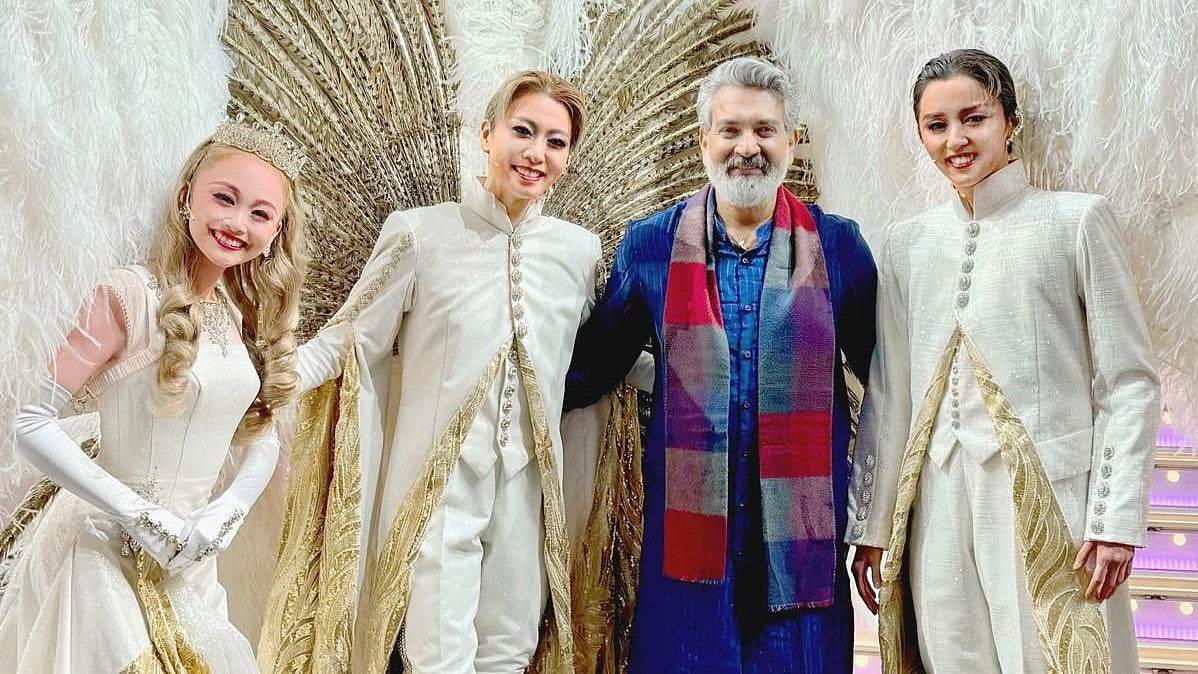 <div class="paragraphs"><p>SS Rajamouli with the women who performed the <em>RRR</em> musical.</p></div>