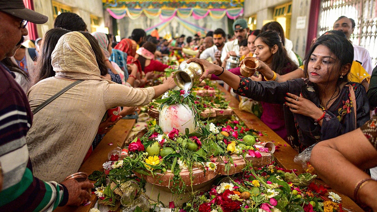 <div class="paragraphs"><p>Devotees in Uttar Pradesh's Prayagraj offer prayers at Shiva temple on the Maha shivratri festival on Friday, 8 March.&nbsp;</p></div>