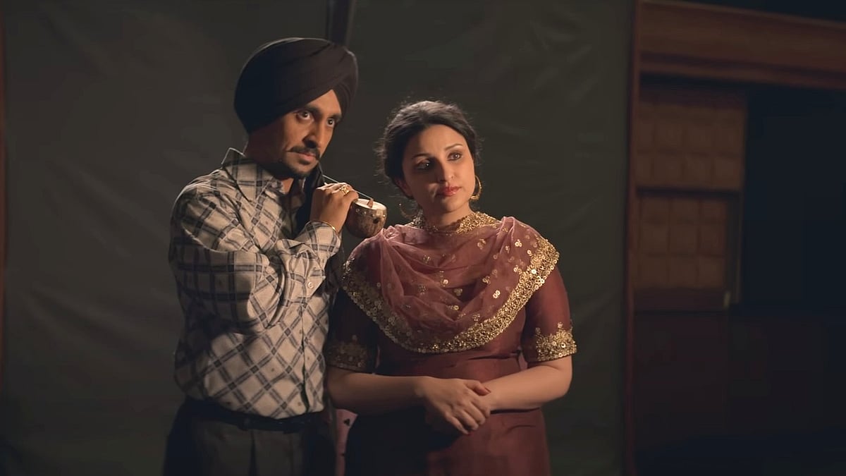 <div class="paragraphs"><p>Diljit Dosanjh and Parineeti Chopra in a still from<em> Chamkila.</em></p></div>
