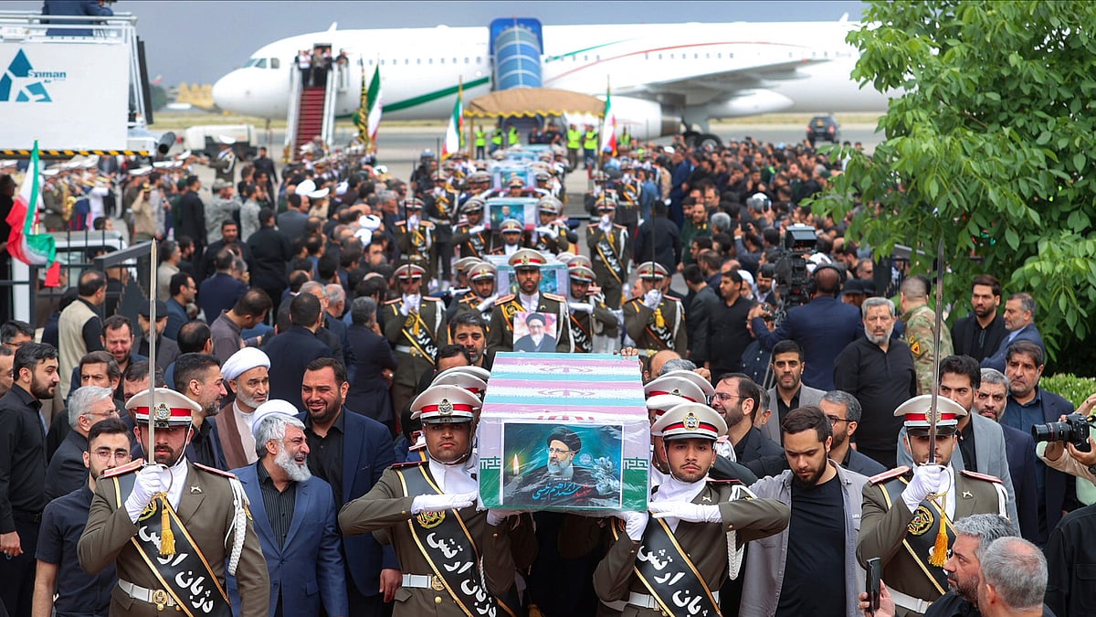 <div class="paragraphs"><p>In this photo released by the Iranian Presidency Office, army officials carry the flag-draped coffins of President Ebrahim Raisi and his companions who were killed in a helicopter crash on Sunday, 19 May, in a mountainous region in the country's northwest.</p></div>