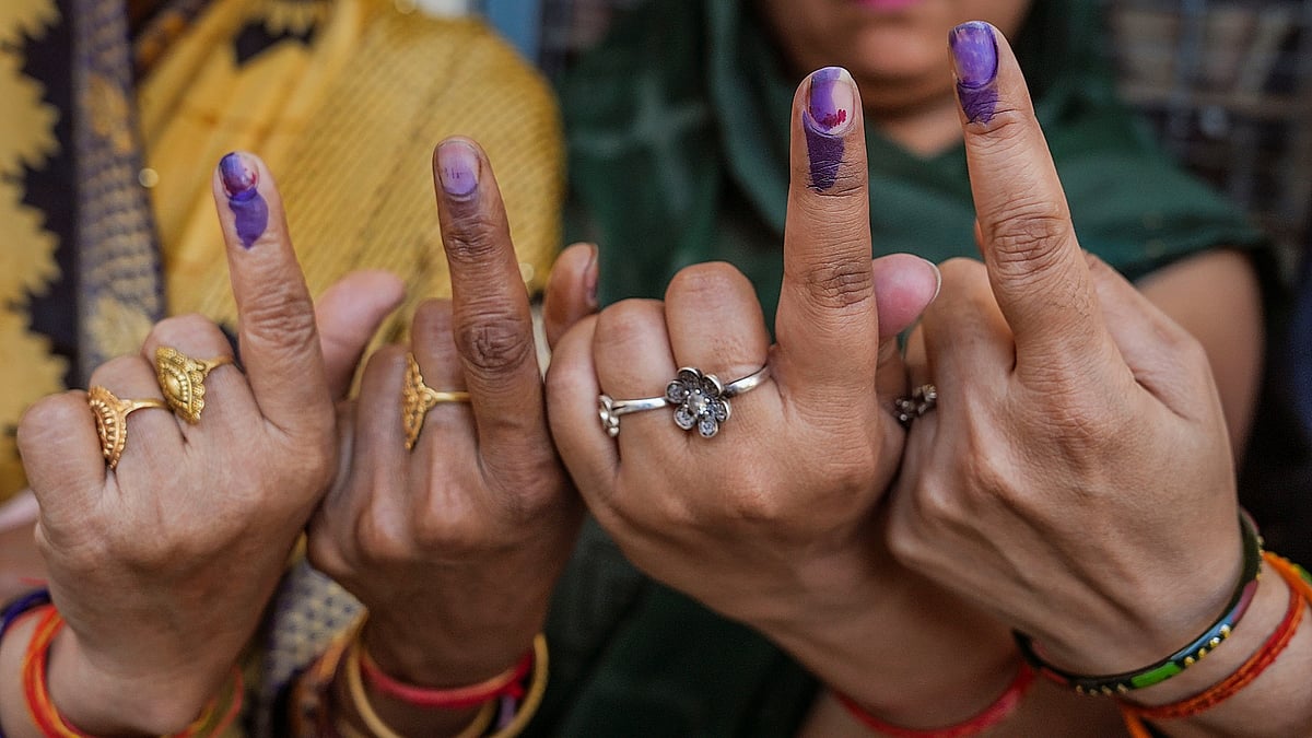 <div class="paragraphs"><p>Voters show their fingers marked with indelible ink after casting votes for the third phase of Lok Sabha elections, in Hathras, Uttar Pradesh on Tuesday, 7 May.</p><p> </p></div>