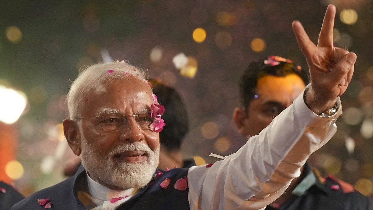 <div class="paragraphs"><p>Prime Minister Narendra Modi greets supporters upon their arrival for a meeting at the party headquarters as the party leads in the Lok Sabha elections amid the counting of votes, in New Delhi, Tuesday, June 4, 2024.</p></div>