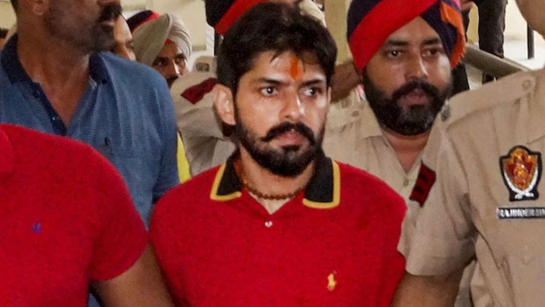 <div class="paragraphs"><p>A file photo of gangster Lawrence Bishnoi being produced in a local court in Punjab's Bathinda in 2022. </p></div>