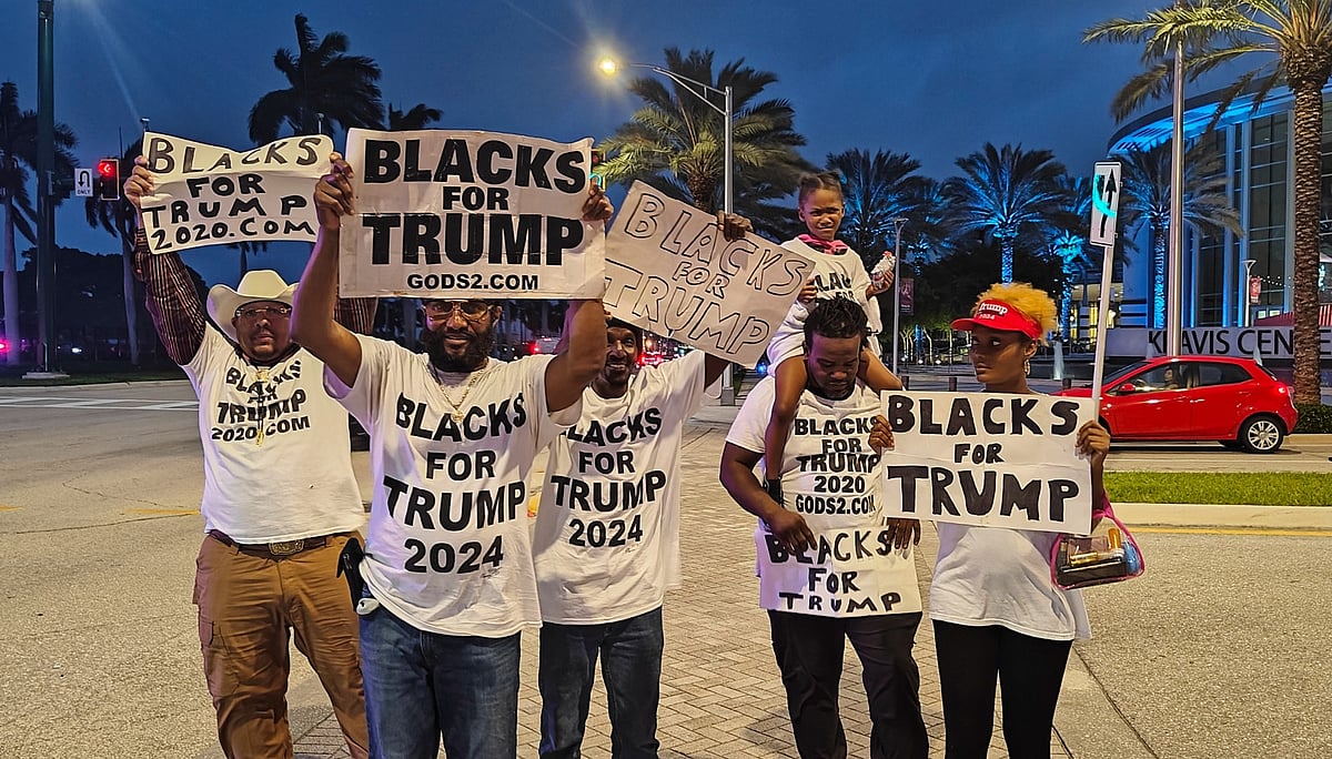 <div class="paragraphs"><p>Palm Beach: Supporters of Republican presidential nominee former President Donald Trump hold banners as they take part in Trumps Election Night Watch Party, at Palm Beach, Florida.</p></div>