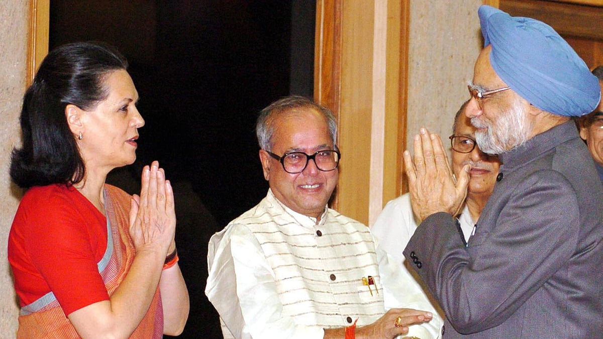 <div class="paragraphs"><p>A 2004 photo of then prime minister Manmohan Singh as seen with former President Pranab Mukherjee and then Congress president Sonia Gandhi in New Delhi.</p></div>