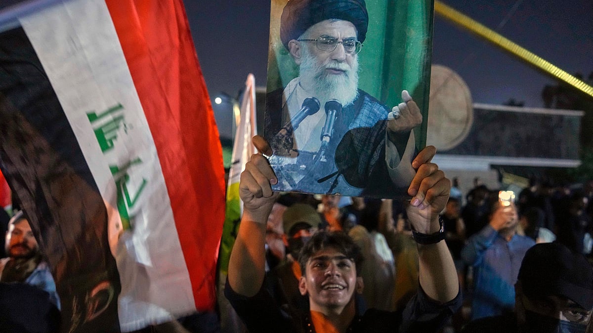 <div class="paragraphs"><p>A protester holds a portrait of Iran's Supreme Leader Ayatollah Ali Khamenei during a protest against Israeli attacks.&nbsp;</p></div>