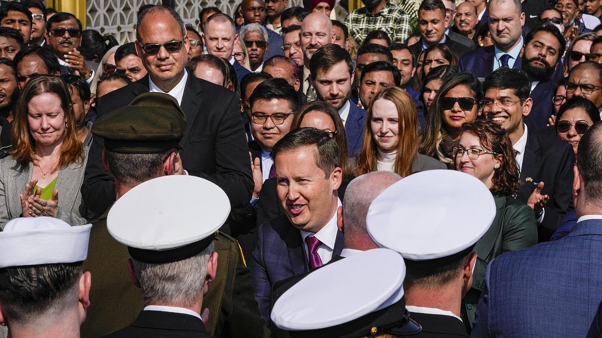 <div class="paragraphs"><p>Sergio Gor (centre) greets officials as he takes charge as the US' Ambassador to India in New Delhi on Monday, 12 January. </p></div>