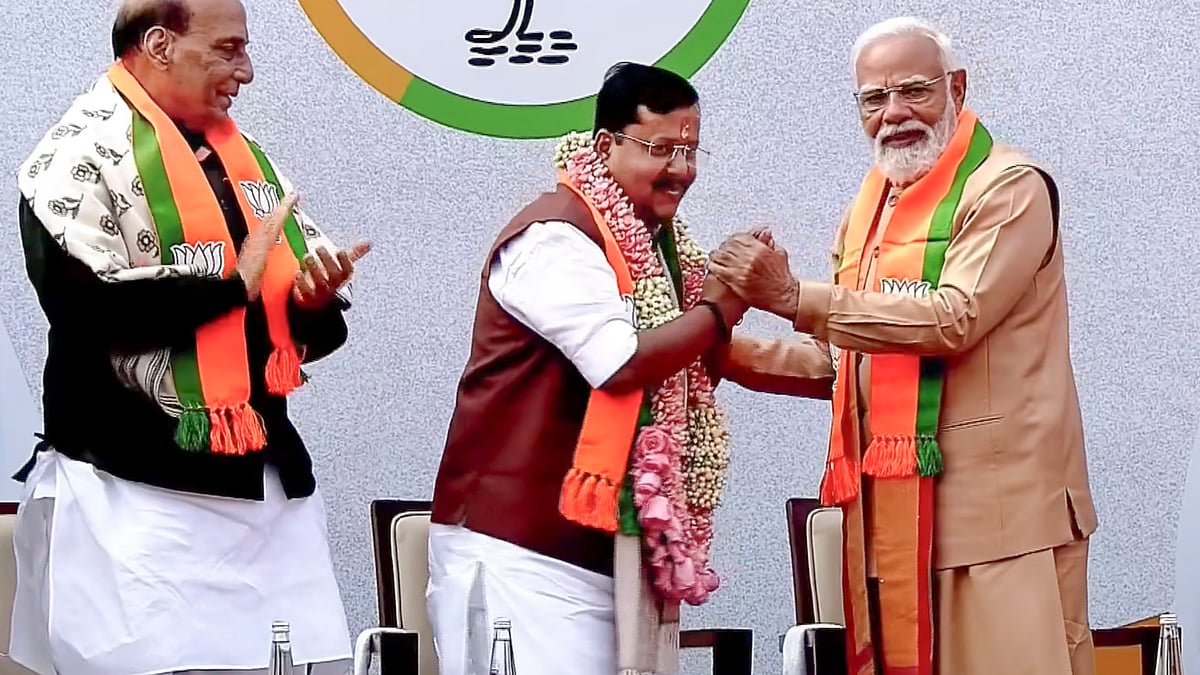 <div class="paragraphs"><p>PM Narendra Modi looks on as newly elected BJP National President Nitin Nabin is greeted by Union Minister and outgoing party president JP Nadda during Nabin's swearing-in, in New Delhi.</p></div>