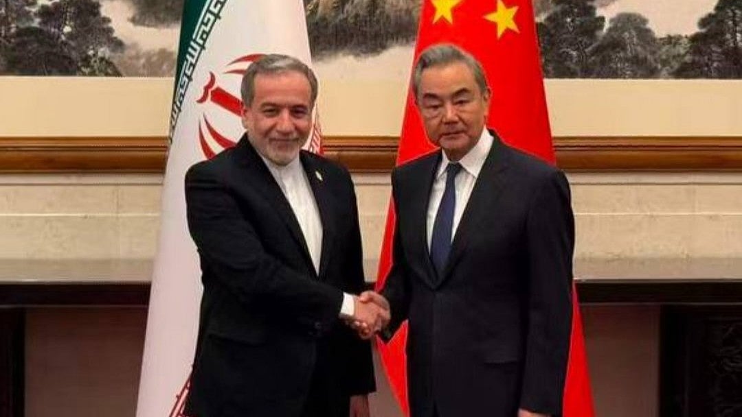 <div class="paragraphs"><p>Abbas Aragachi (left) and Wang Yi.&nbsp;</p></div>