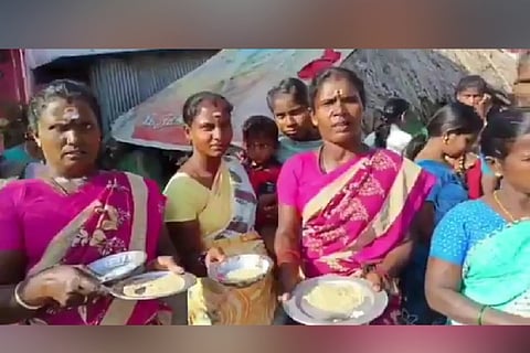 Women standing with aarthi plate filled with poor quality rice to welcome AIADMK MLA