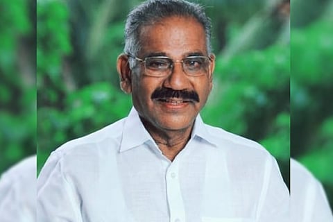 Kerala Forest Minister AK Saseendran in white dress smiling 
