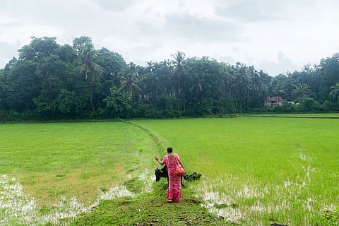 ASHA worker walking to get to her work