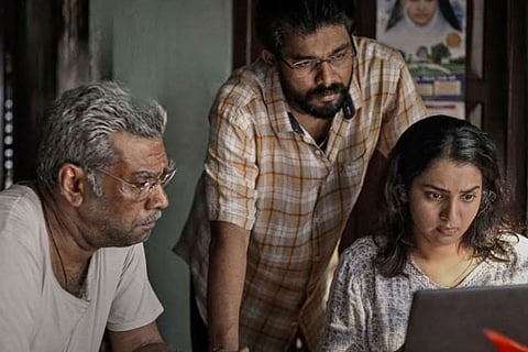 Parvathy Thiruvothu, Biju Menon and Sharaf U Dheen seen in the poster of 'Aarkkariyam'.