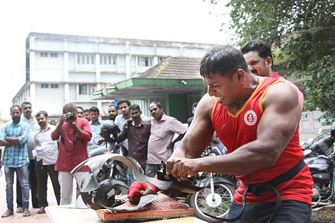 Abheesh breaking a helmet  with the force of his wrist