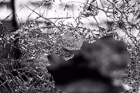 Black and white image of shattered glass